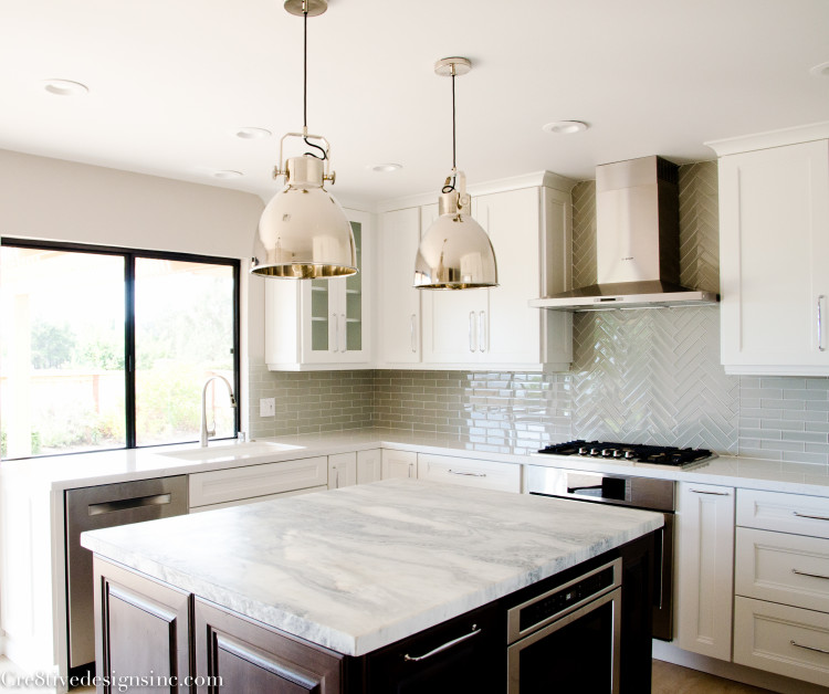 Dark kitchen cabinets with honed marble countertop