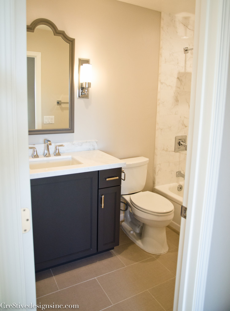 Calcutta look porcelain tile in a shower