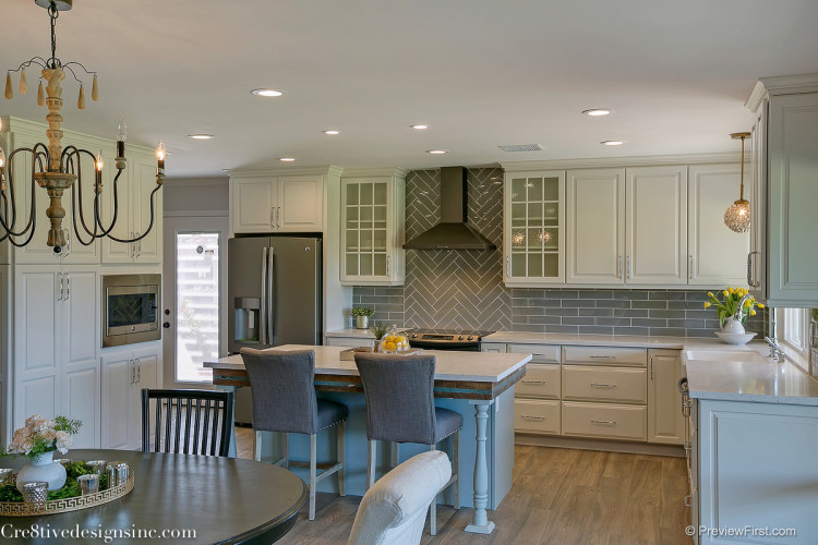 Ivory shaker cabinets and gray backsplash