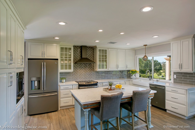 Ivory shaker cabinets and gray backsplash